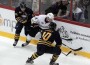 Koivu of Anaheim Ducks fights for puck with Ehrhoff and Sekera of Buffalo Sabres during their NHL premiere ice hockey match in Helsinki