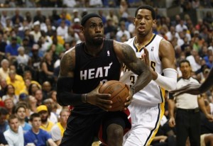 Miami's James passes Indiana's Granger during an NBA basketball game in Indianapolis